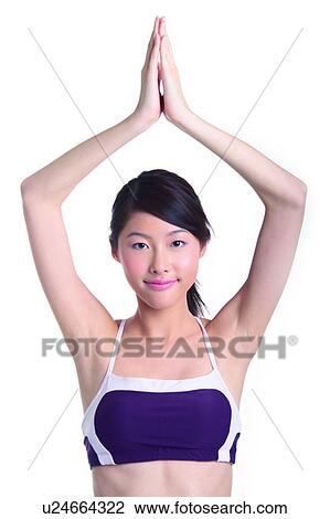 Young woman in yoga position, smiling View Large Photo Image Stock Image - Young woman in yoga position, smiling. Fotosearch