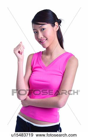 Young woman standing, waist up, front view View Large Photo Image Stock Photo - Young woman standing, waist up, front view. Fotosearch
