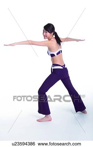 Young woman with arms outstretched, smiling, rear view View Large Photo Image Stock Photograph - Young woman with arms outstretched, smiling, rear view. Fotosearch