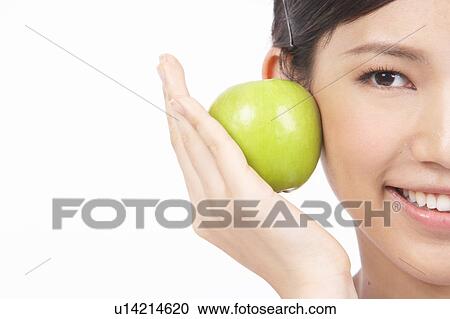 Portrait of Natural Young girl Holding Apple View Large Photo Image Stock Image - Portrait of Natural Young girl Holding Apple. Fotosearch