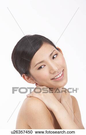 Portrait of Natural Young girl touching shoulder View Large Photo Image Stock Image - Portrait of Natural Young girl touching shoulder. Fotosearch