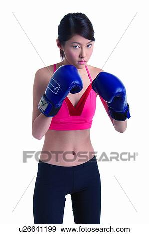 Stock Photo - Young woman boxing. Fotosearch