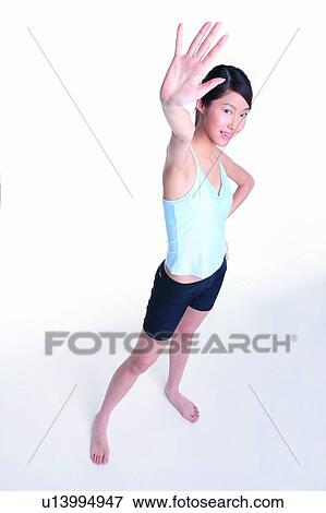 Stock Photo - Young woman looking up. Fotosearch