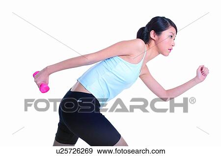 Stock Photo - Young woman participating in Relay Race. Fotosearch