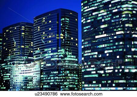 Stock Photograph - Office buildings long exposure, Hong Kong, Tsim Sha Tsui. Fotosearch