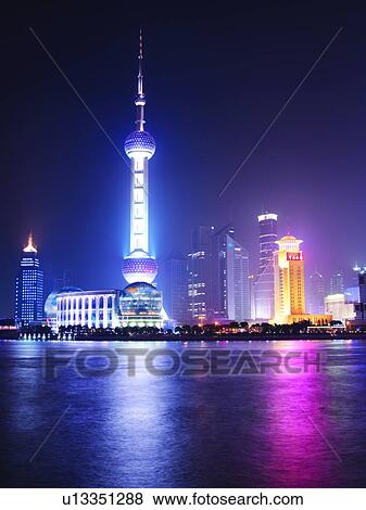 Stock Photo - Oriental Pearl Tower, China, Shanghai, skyline across water, night. Fotosearch