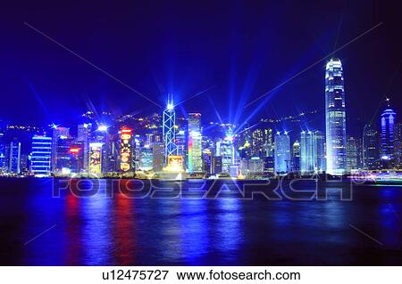 Stock Photo - Symphony of Light, Hong Kong Victoria Harbour and city skyline. Fotosearch