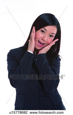Young woman in business suit, making face View Large Photo Image Stock Image - Young woman in business suit, making face. Fotosearch