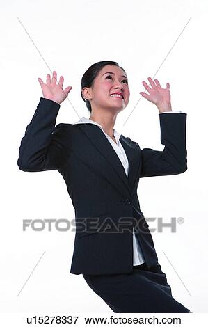 Young woman in business suit, hand up, surprised View Large Photo Image Stock Photo - Young woman in business suit, hand up, surprised. Fotosearch