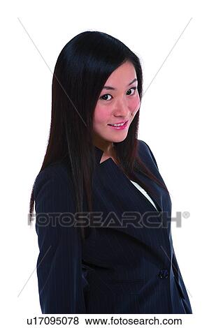 Young woman in business suit, looking at camera View Large Photo Image Stock Photo - Young woman in business suit, looking at camera. Fotosearch