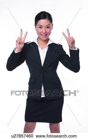 Young woman in business suit, raising four fingers View Large Photo Image Stock Image - Young woman in business suit, raising four fingers. Fotosearch