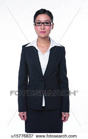 Stock Photo - Young woman in business suit, standing straightly. Fotosearch