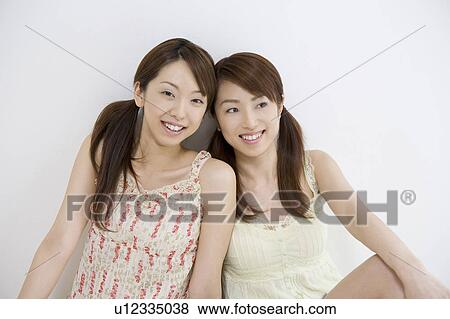 Stock Photo - Girl friend with good relations. Fotosearch