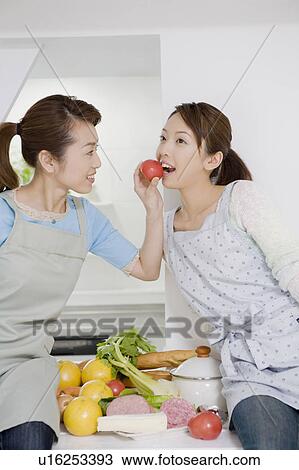 Stock Image - Women who cook. Fotosearch