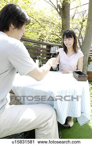 Stock Image - Drinking at the terrace. Fotosearch