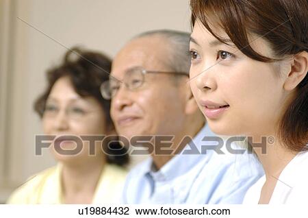 Stock Image - Elderly couple and the bride. Fotosearch