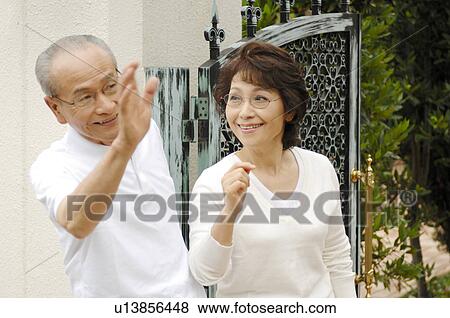 Grandad and grandma who wave a hand View Large Photo Image Stock Photo - Grandad and grandma who wave a hand. Fotosearch