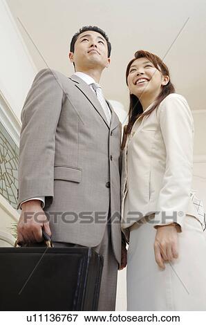 Husband and wife before going to the office View Large Photo Image Stock Photo - Husband and wife before going to the office. Fotosearch