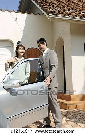 Husband and wife before going to the office View Large Photo Image Stock Photo - Husband and wife before going to the office. Fotosearch