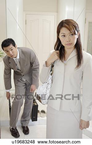 Stock Photo - Husband and wife before going to the office. Fotosearch