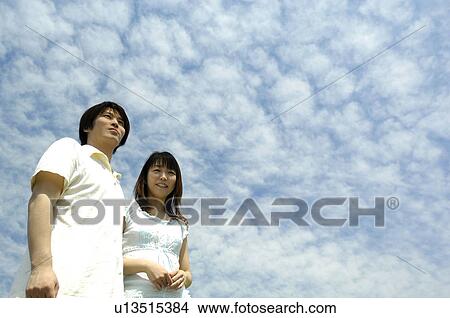 Husband and wife under the blue sky View Large Photo Image Picture - Husband and wife under the blue sky. Fotosearch