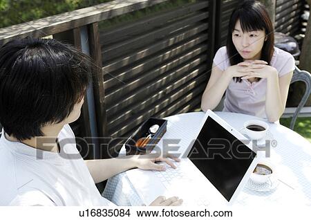 Husband and wife who relaxes at the terrace View Large Photo Image Picture - Husband and wife who relaxes at the terrace. Fotosearch