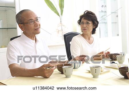 Old couple eats a meal View Large Photo Image Stock Image - Old couple eats a meal. Fotosearch