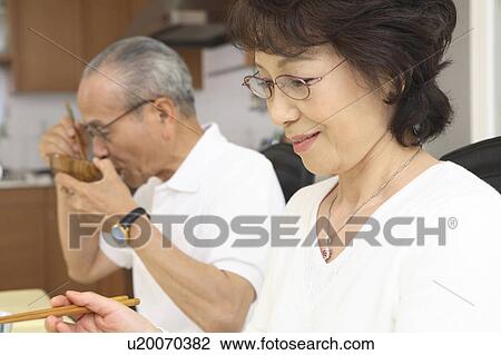 Old couple eats a meal View Large Photo Image Stock Image - Old couple eats a meal. Fotosearch
