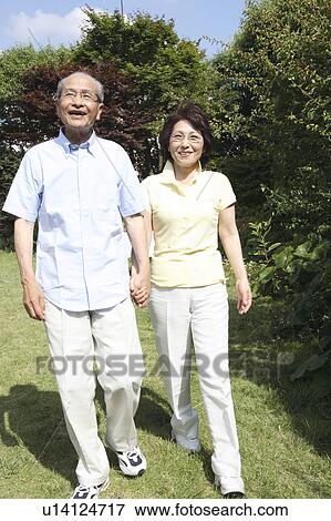 Old couple taking a walk View Large Photo Image Stock Photo - Old couple taking a walk. Fotosearch