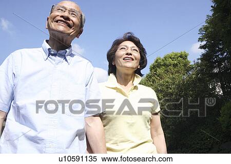 Stock Photography - Old couple taking a walk. Fotosearch