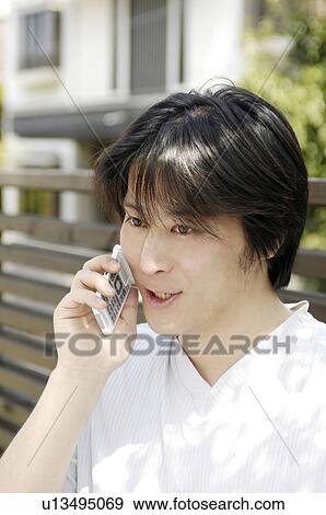 Stock Photo - Man talking with a cell phone. Fotosearch