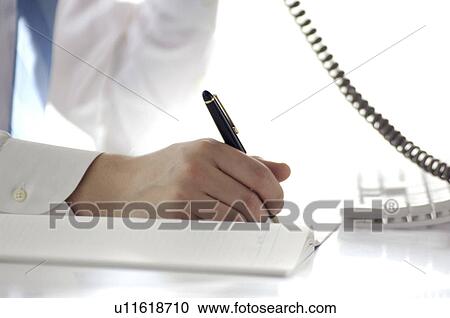 Office worker who takes notes View Large Photo Image Stock Image - Office worker who takes notes. Fotosearch