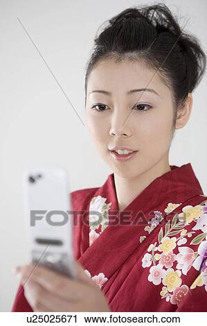 Yukata woman who sees a portable View Large Photo Image Stock Image - Yukata woman who sees a portable. Fotosearch