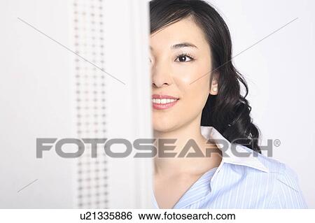 Stock Photograph - Bbusiness lady looking at a PC monitor. Fotosearch