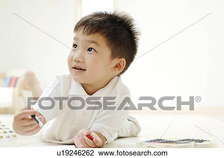 Stock Image - Boy doing drawing. Fotosearch