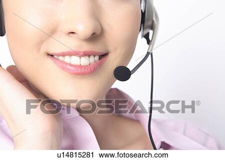 Business lady talking in headset View Large Photo Image Stock Image - Business lady talking in headset. Fotosearch
