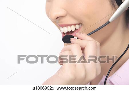 Business lady talking in headset View Large Photo Image Stock Photography - Business lady talking in headset. Fotosearch
