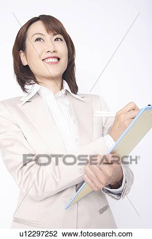 Business lady to write something in the document of the clipboard View Large Photo Image Stock Image - Business lady to write something in the document of the clipboard. Fotosearch