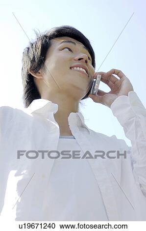 Man calling by a cell phone View Large Photo Image Stock Image - Man calling by a cell phone. Fotosearch