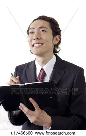 Office worker who takes a note View Large Photo Image Stock Image - Office worker who takes a note. Fotosearch