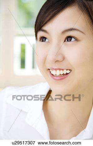 Stock Photo - Smiling woman. Fotosearch