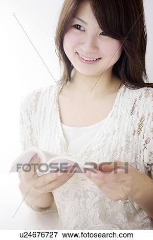 Woman reading a book View Large Photo Image Stock Photo - Woman reading a book. Fotosearch
