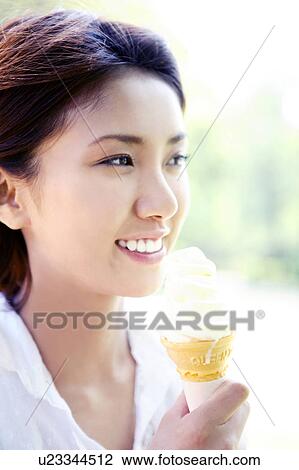 Woman who eats ice cream View Large Photo Image Stock Image - Woman who eats ice cream. Fotosearch