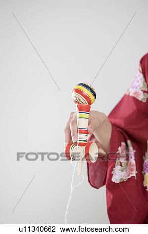 Stock Image - Cup-and-ball. Fotosearch