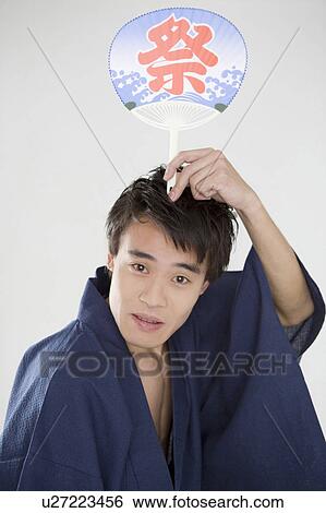 Stock Photograph - Fan and yukata man. Fotosearch