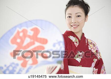 Stock Photography - Fan and yukata woman. Fotosearch