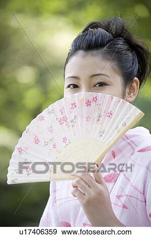 Japanese folding fan and yukata woman View Large Photo Image Stock Photo - Japanese folding fan and yukata woman. Fotosearch