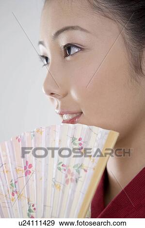 Stock Photo - Japanese folding fan and yukata woman. Fotosearch