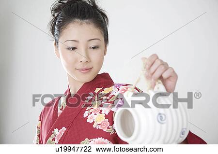 Stock Image - Mosquito coil and yukata woman. Fotosearch