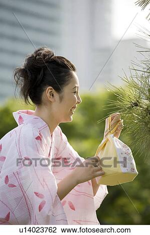 Stock Image - Verdure and yukata woman. Fotosearch